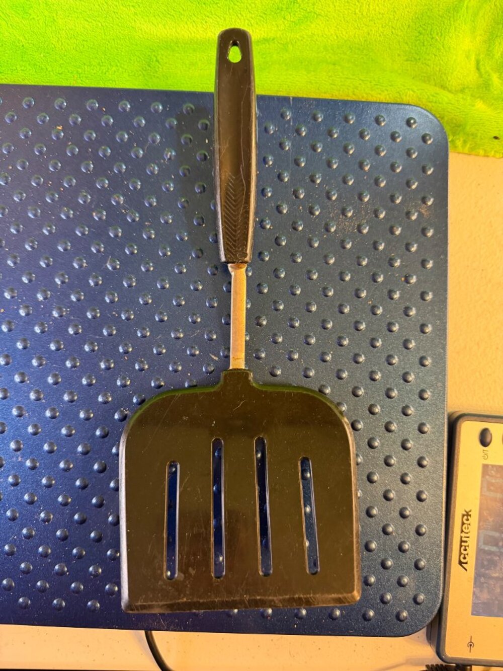 Vintage Black Slotted Metal Spatula with Plastic Handle